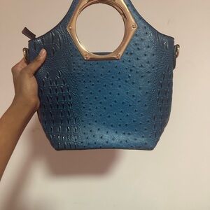 Elegant Blue Handbag with Gold Accents